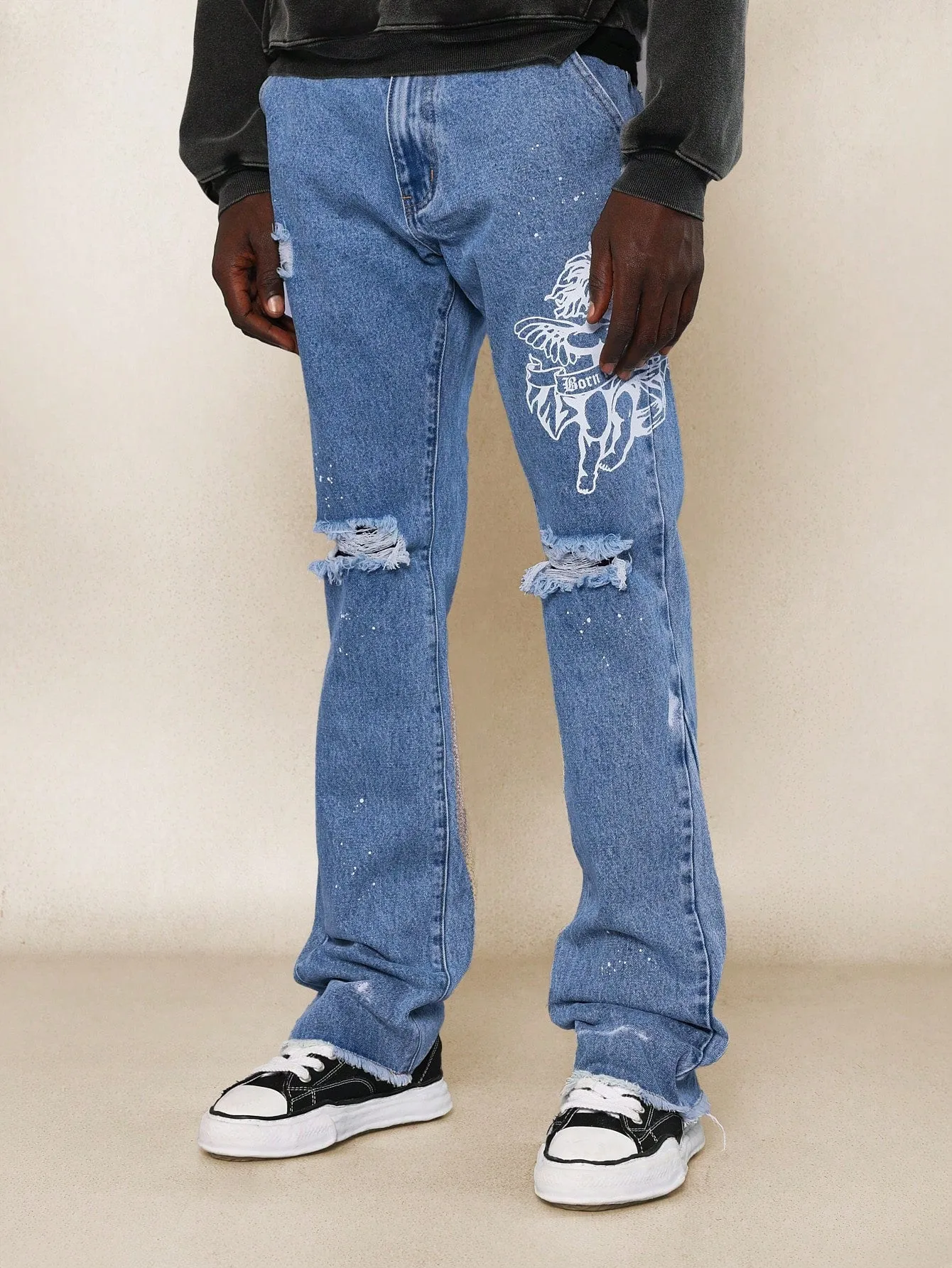 Flare Fit Raw Edge Ripped Jean With Graphic Print